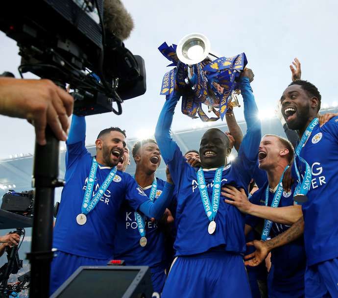 Kante lifting the Premier League trophy with Leicester City