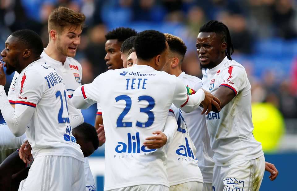 Bertrand Traore celebrates with the Lyon players