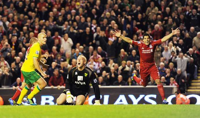 Luis Suarez celebrates scoring against Norwich