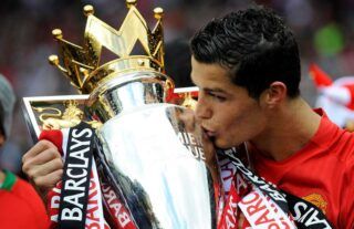 Cristiano Ronaldo kisses Premier League trophy