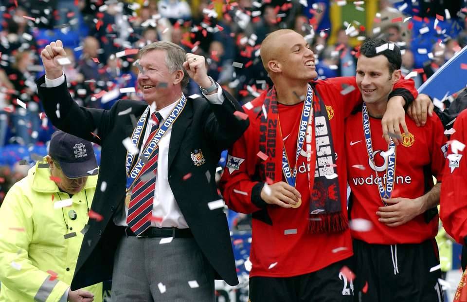 Manchester United's Sir Alex Ferguson, Ryan Giggs and Wes Brown celebrate winning the Premier League title