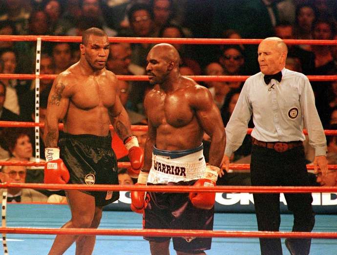 Mike Tyson and Evander Holyfield eye each other out