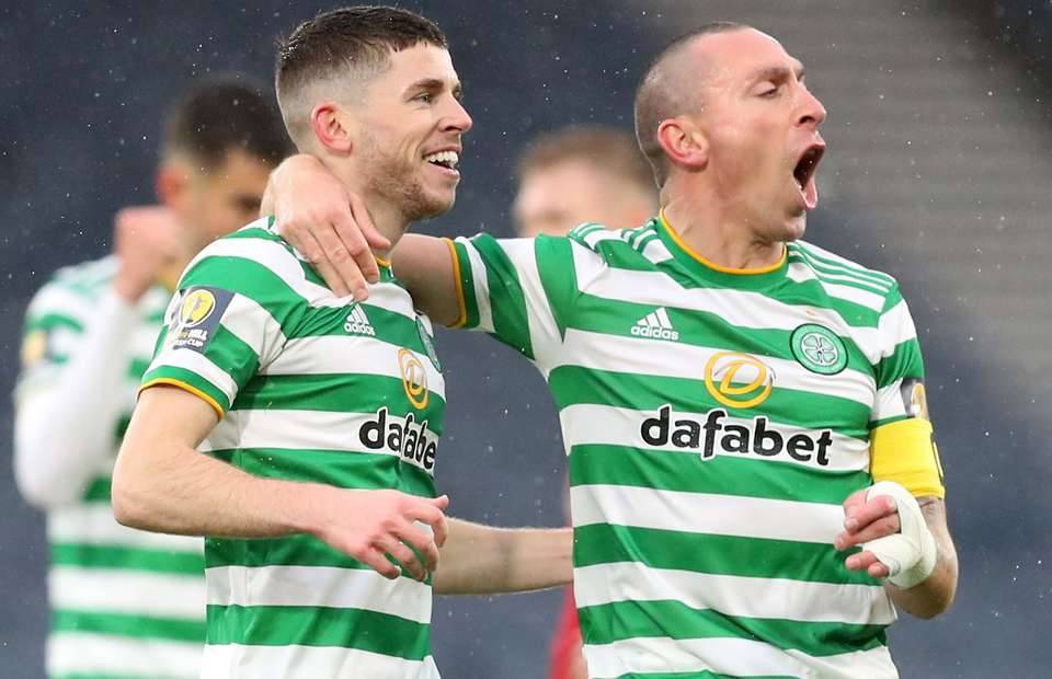 Ryan Christie (left) and Scott Brown in action for Celtic