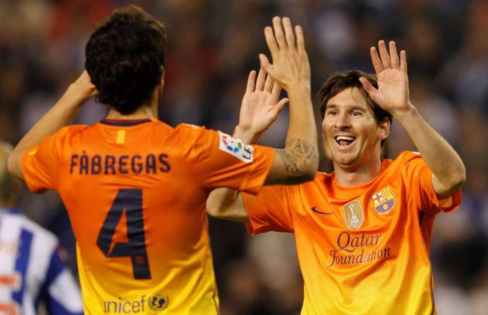 Cesc Fabregas and Lionel Messi