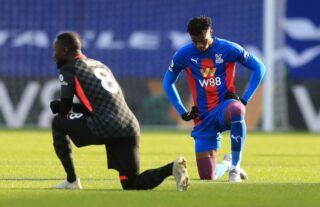 Wilfried Zaha takes the knee for Crystal Palace