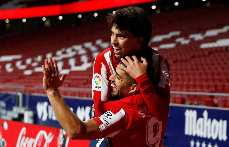 Atletico Madrid forward Joao Felix celebrates with Luis Suarez