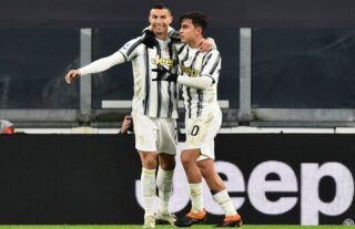 Juventus forward Paulo Dybala celebrates with Cristiano Ronaldo