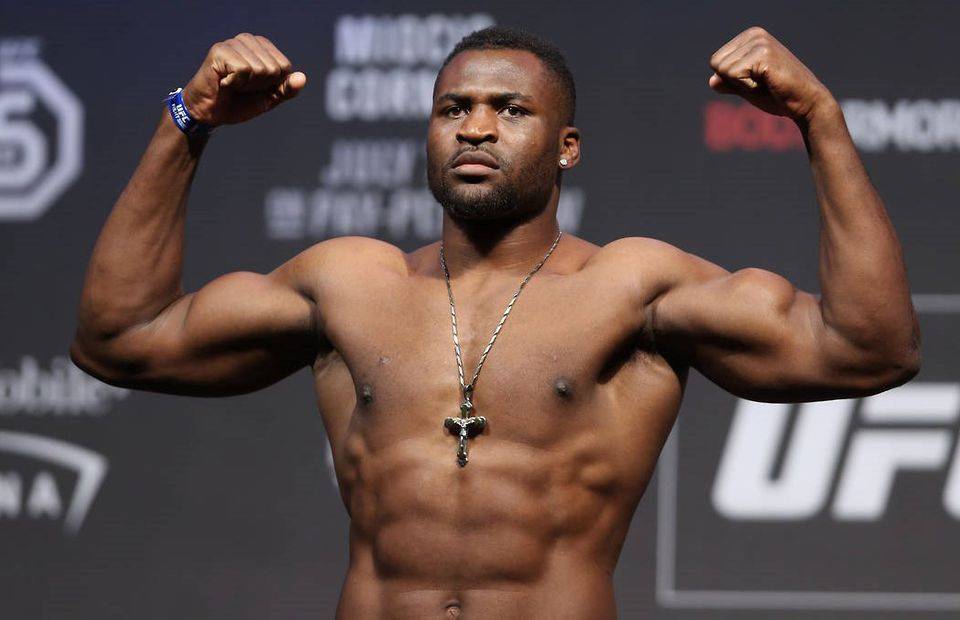 Francis Ngannou poses during the weigh-in