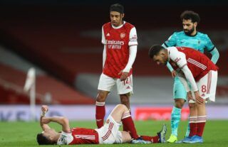 Arsenal defender Kieran Tierney goes down injured