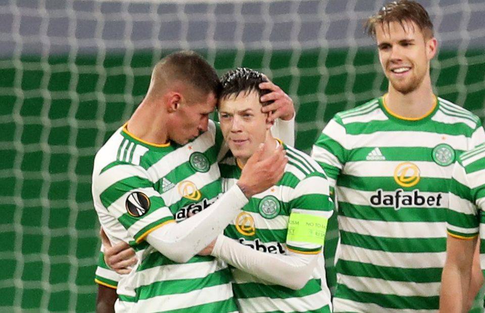 Celtic midfielder Callum McGregor celebrates with his teammates