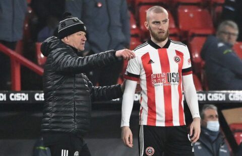Sheffield United striker Oli McBurnie receiving instructions from Chris Wilder