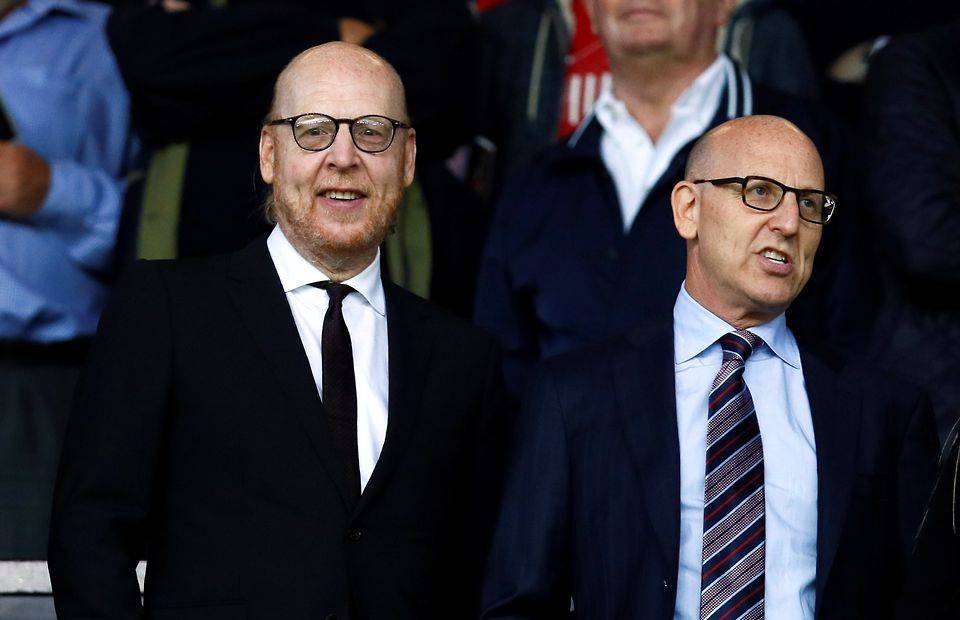 Manchester United co owners Joel Glazer (R) and Avram Glazer in the stands before the match