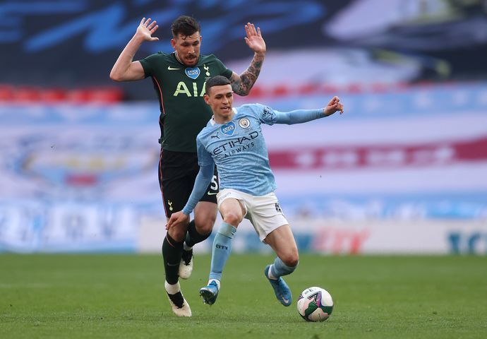 Phil Foden dribbles past Pierre Emile-Hojbjerg