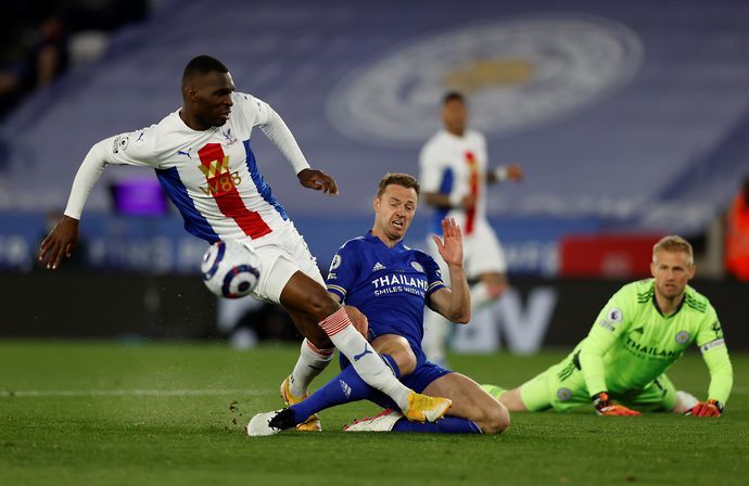 Jonny Evans tackles Christian Benteke for Leicester vs Palace