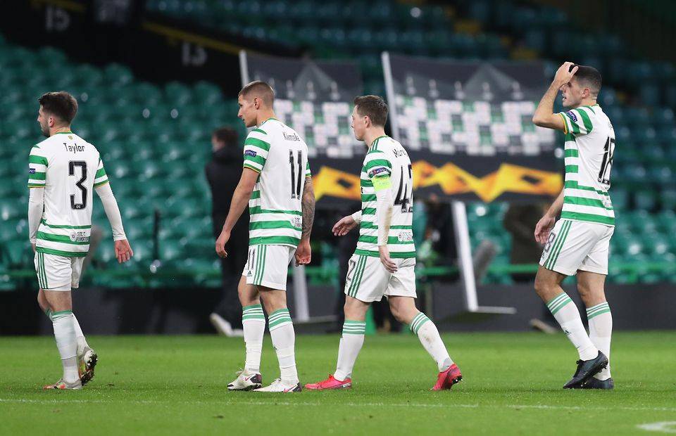 Celtic players look dejected after losing to AC Milan in the Europa League