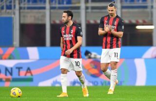 Zlatan Ibrahimovic and Hakan Calhanoglu in action for AC Milan