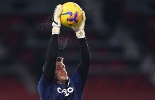 Aston Villa goalkeeper Tom Heaton warms up against Manchester United at Old Trafford