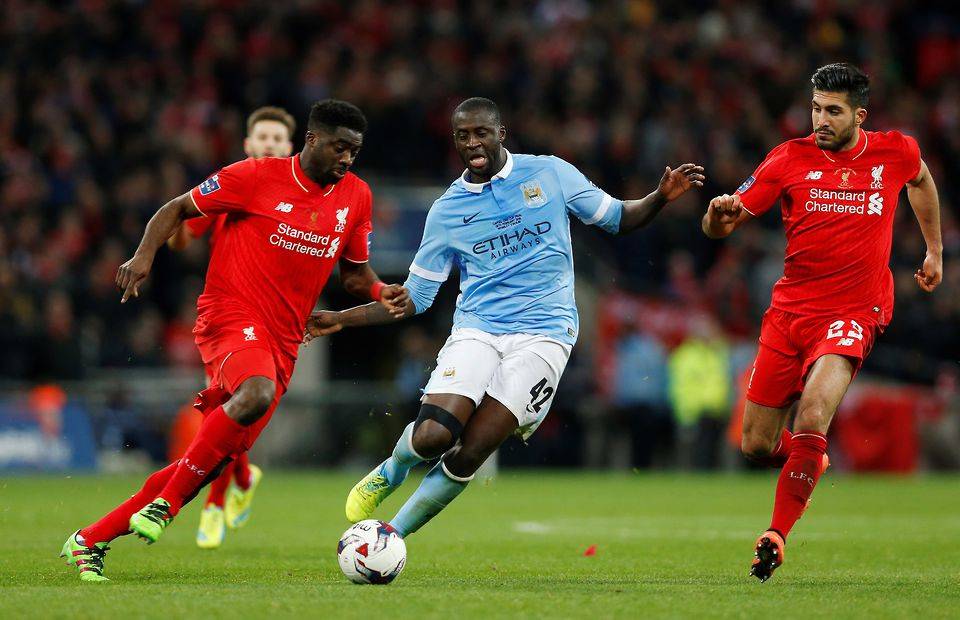 Liverpool's Kolo Toure and Manchester City's Yaya Toure in action
