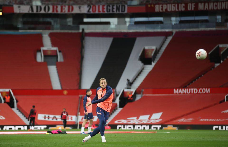 Tottenham Hotspur striker Harry Kane warms up at Old Trafford before playing Manchester United in the Premier League