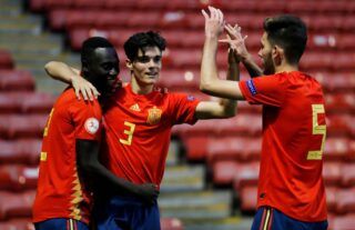 Spain's Miguel Gutierrez celebrates with his teammates after scoring