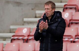 Brighton manager and potential Tottenham target Graham Potter clapping