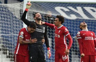 Alisson Becker celebrates scoring for Liverpool vs West Brom