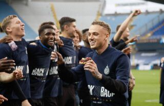 Noa Lang celebrates with Club Brugge after winning the Belgian league title