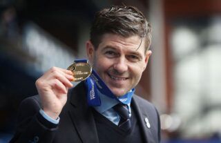 Rangers manager Steven Gerrard celebrates winning the Scottish Premeirship at Ibrox