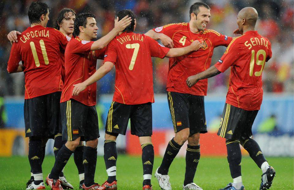 Spain's players celebrate together during a dominant opening win