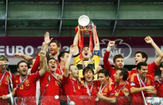 Spain lift the European Championship trophy after a stunning display in the final
