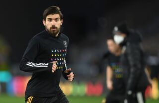 Wolves midfielder and Arsenal target Ruben Neves warming up