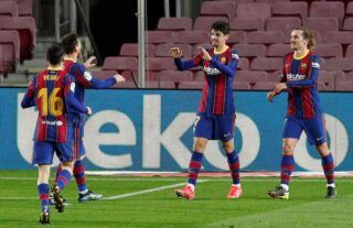 Barcelona winger and Wolves target Trincao celebrating with teammates