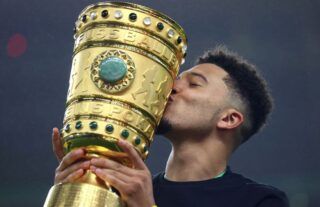 Borussia Dortmund star Jadon Sancho celebrates winning the DFB Pokal