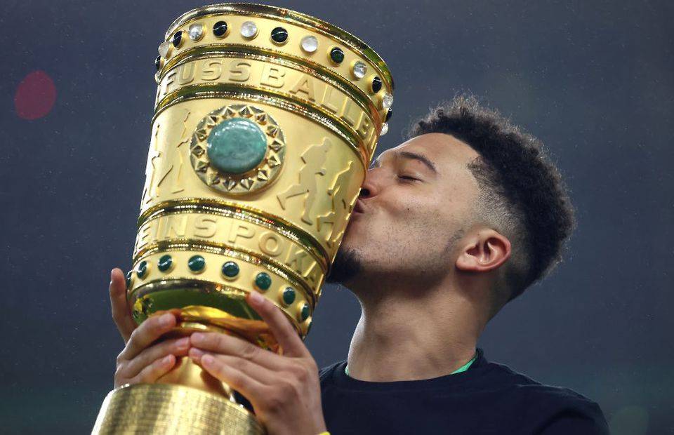 Borussia Dortmund star Jadon Sancho celebrates winning the DFB Pokal