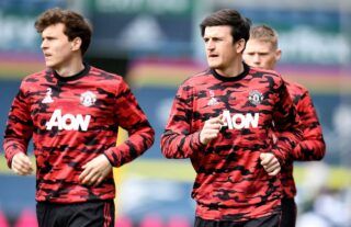 Harry Maguire and Victor Lindelof warming up for Manchester United amid speculation that the Red Devils are looking for another centre-back