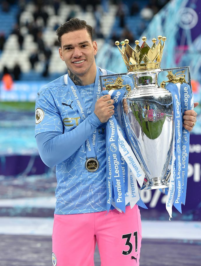 Ederson with the PL trophy