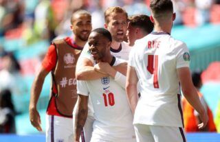 Raheem Sterling and Harry Kane celebrate after England beat Croatia