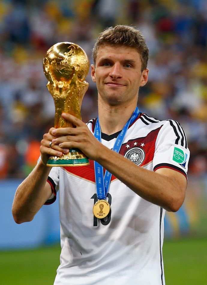 Muller with the World Cup trophy