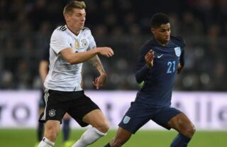 Toni Kroos and Marcus Rashford in action for Germany vs England