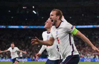 Harry Kane celebrates with Phil Foden after scoring the winner for England in the Euro 2020 semi-final