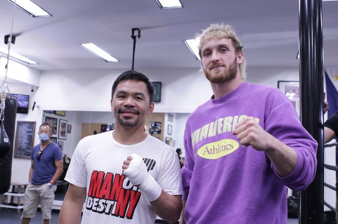 Boxing icon Manny Pacquiao poses for a picture with YouTube star Logan Paul during training 