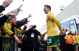 Kenny McLean celebrates winning promotion with Norwich City