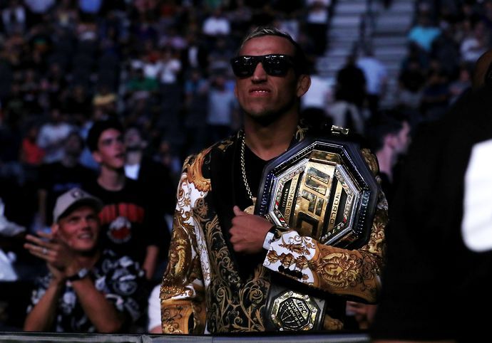 Charles Oliveira watches Dustin Poirier beat Conor McGregor