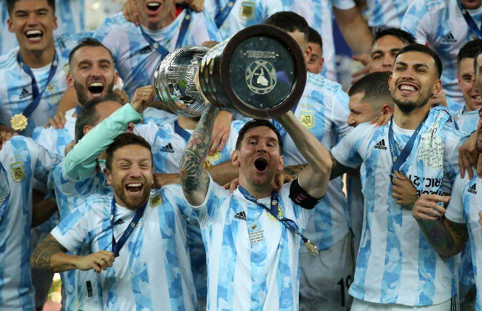 Lionel Messi lifts the 2021 Copa America trophy with Argentina