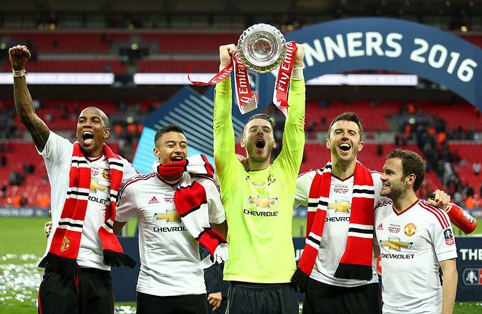 Ashley Young celebrates winning the FA Cup with Manchester United