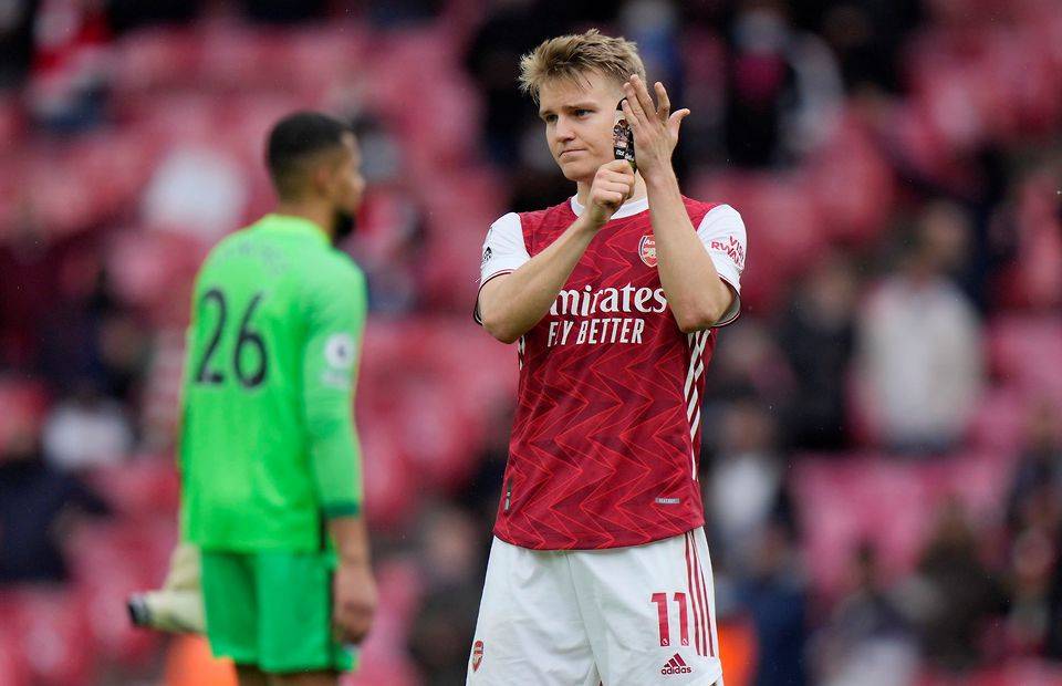 Martin Odegaard applauds the Arsenal support