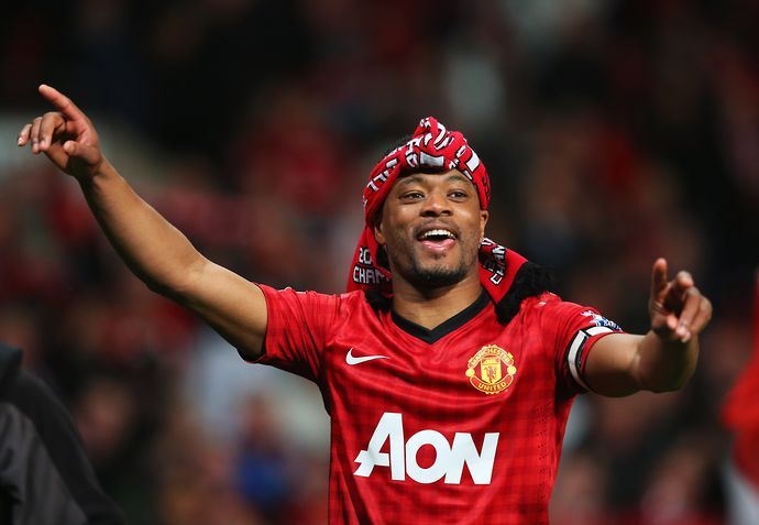 Patrice Evra with a United scarf wrapped around his head