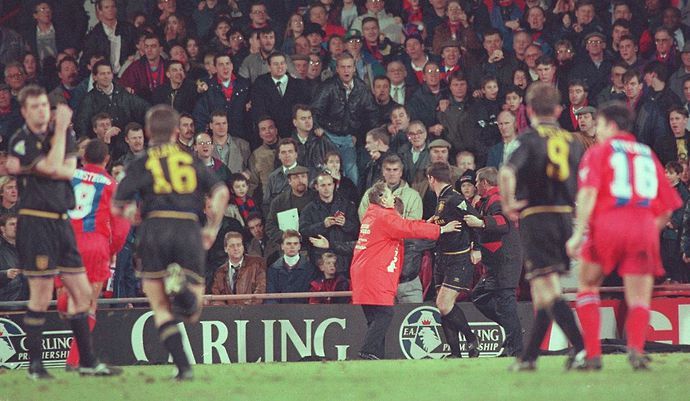Eric Cantona kicks a Crystal Palace fan