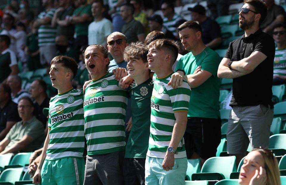 Celtic fans watch their side in action