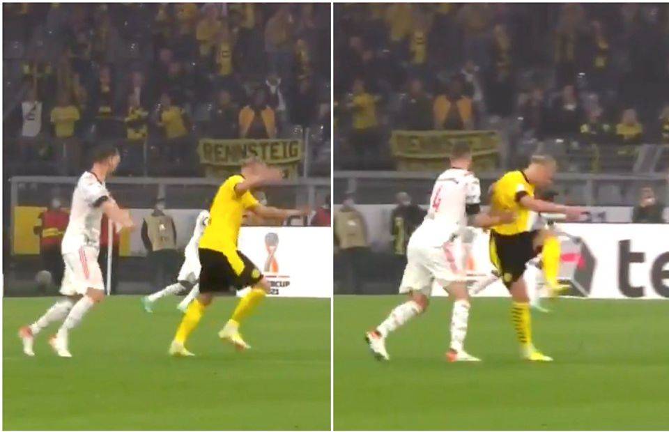 Erling Haaland reacts to Robert Lewandowski's goal for Bayern vs Dortmund
